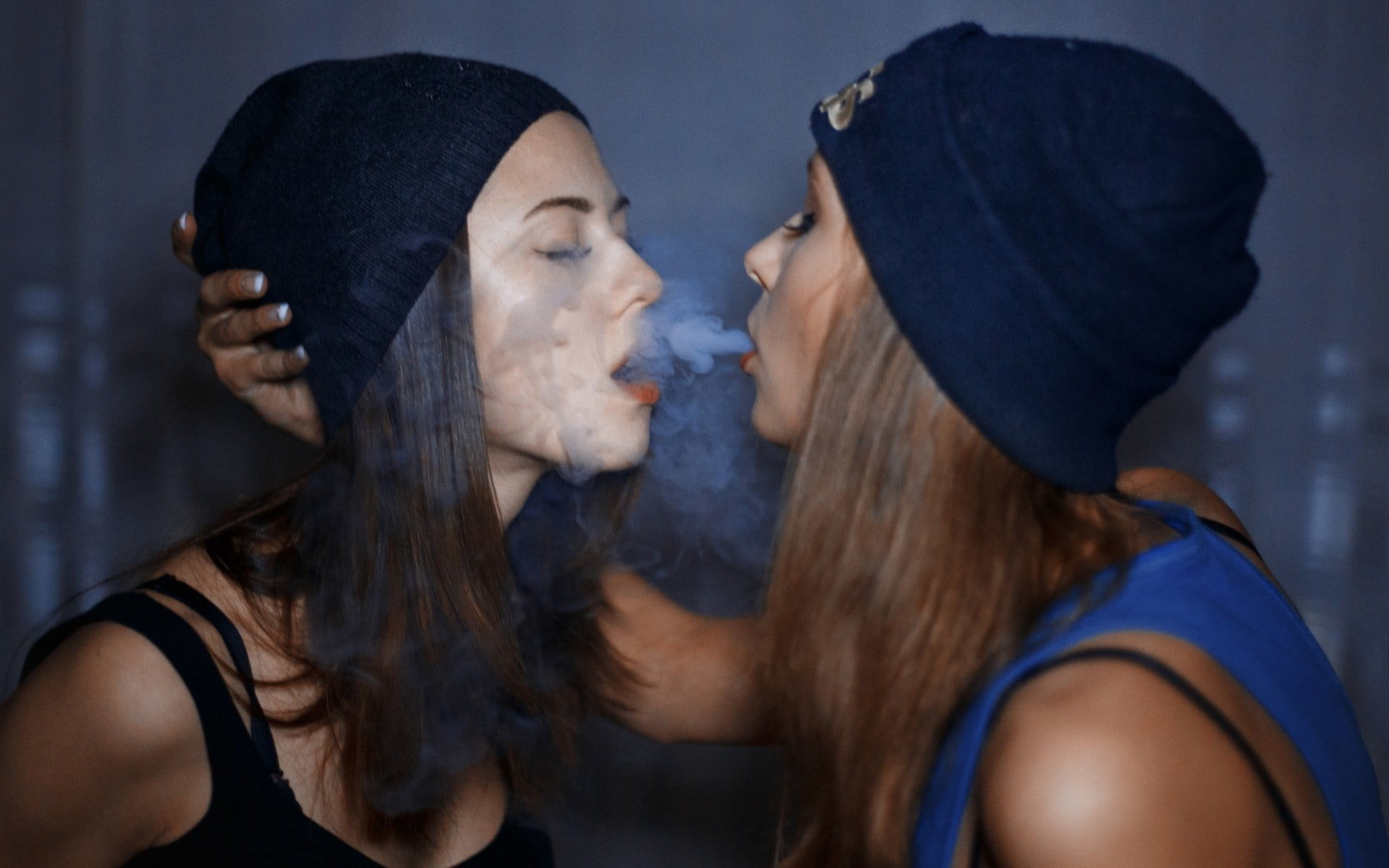 During facesitting girl smokes vape