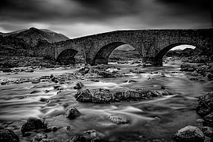 grayscale photography of concrete bridge below river, sligachan HD wallpaper