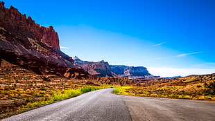 highway near rock formations at daytime