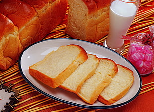 four bread slices on top of oval white ceramic plate HD wallpaper