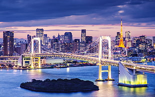 yellow bridge under cloudy sky