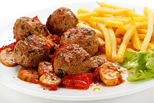 photography of baked meat balls and fries