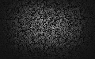 photo of black and white floral printed textile in dim light