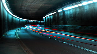 time lapse photography of tunnel