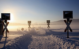 black road signage lot, winter, snow, Sun, sky HD wallpaper