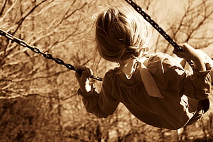 girl wearing gray long sleeve dress riding on swing during daytime HD wallpaper