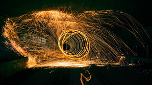 timelapse photography of round yellow sparks HD wallpaper