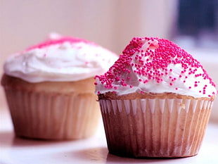 two white cupcakes with pink sprinkles on top HD wallpaper