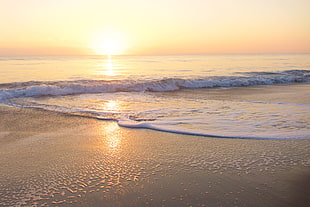 body of water during sunset