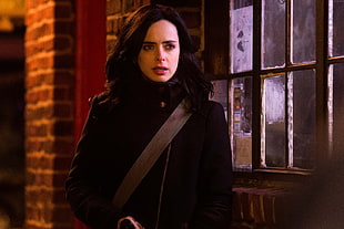 woman in black jacket beside window HD wallpaper