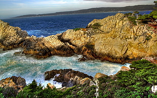 rocky mountain near beach during daytime