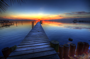 body of water during sunset