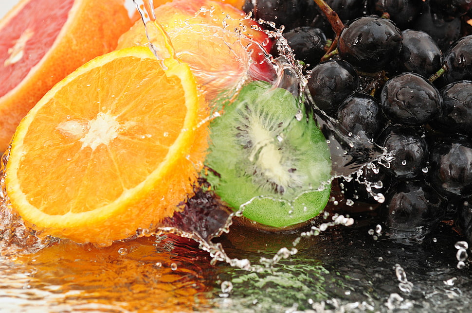 assorted colored fruits with water HD wallpaper