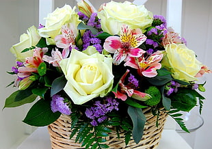 purple, yellow and pink flower bouquet on brown wicker basket HD wallpaper