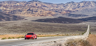 red car on a road HD wallpaper