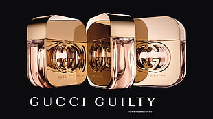 three Gucci Guilty fragrance bottles HD wallpaper