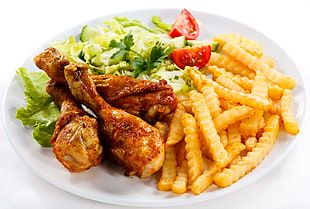 three fried chicken with french fries and vegetables both on round white ceramic plate HD wallpaper
