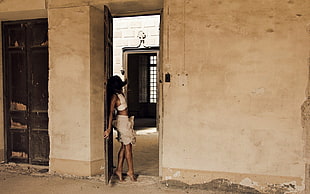 woman standing on door HD wallpaper