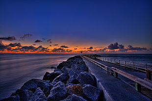 photo of rock formation near body of water during sunset, jupiter inlet HD wallpaper