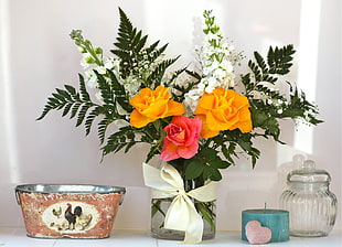 yellow and pink flower arrangement beside bucket HD wallpaper