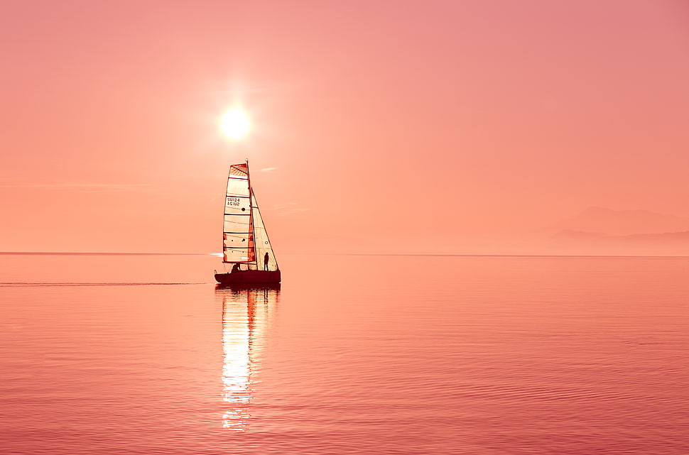 brown sail boat on body of water HD wallpaper