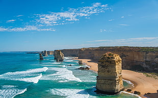 body of water near rock formation, coast, nature, landscape, beach