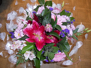 pink and purple flowers on brown surface