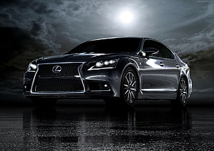 black Lexus sedan under cloudy sky