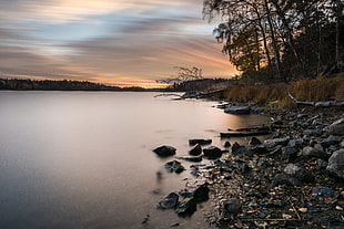 landscape photography of black rocks surrounded by body of water, drevviken