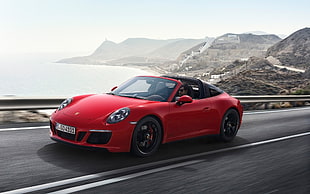 red Porsche 911 convertible on road during daytime HD wallpaper