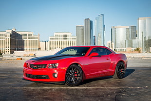 red Chevrolet Camaro on road