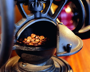 brown coffee beans on black container