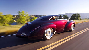 maroon vintage coupe cruising on the street during daytime HD wallpaper