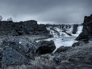 grayscale waterfalls photo