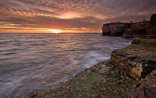 landscape photography of body of water during sunset