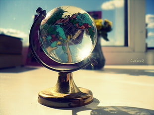 selective focus photography of terrestrial desk globe