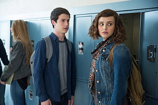 girl wearing blue denim button-up jacket beside locker and boy in blue dress shirt and grey crew-neck shirt HD wallpaper