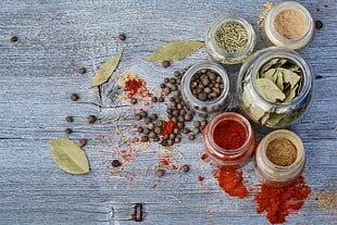 assorted seasonings in clear glass jars HD wallpaper