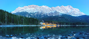 white snowcape mountains near trees under blue sky, eibsee