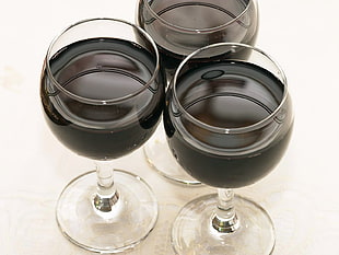 three black liquids on clear glass goblets HD wallpaper
