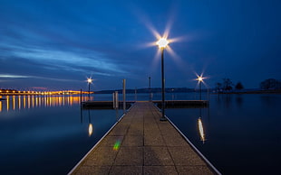 brown dock with light post beside body of water HD wallpaper