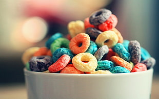 assorted-color cereals on white ceramic bowl HD wallpaper