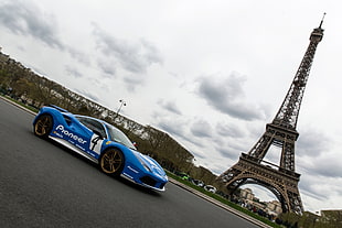 blue Ferrari 488 GTB parked near Eiffel Tower, Paris HD wallpaper