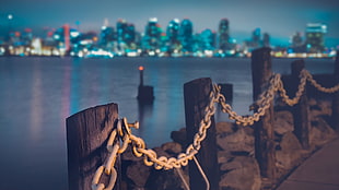 white metal chains, water, city, lights HD wallpaper