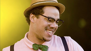 man wearing pink top. brown wicker hat and eyeglasses HD wallpaper