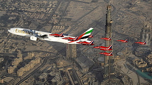 red Fly Emirates airplane, aircraft, cityscape, Boeing, Dubai HD wallpaper
