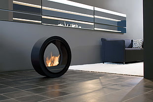 round black electric fireplace turned on HD wallpaper