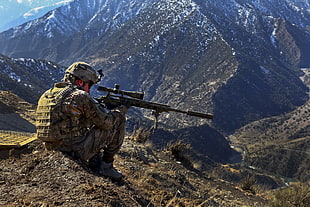 soldier holding black rifle