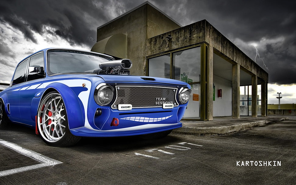 selective photography of blue car on road HD wallpaper