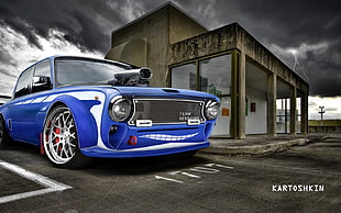 selective photography of blue car on road HD wallpaper